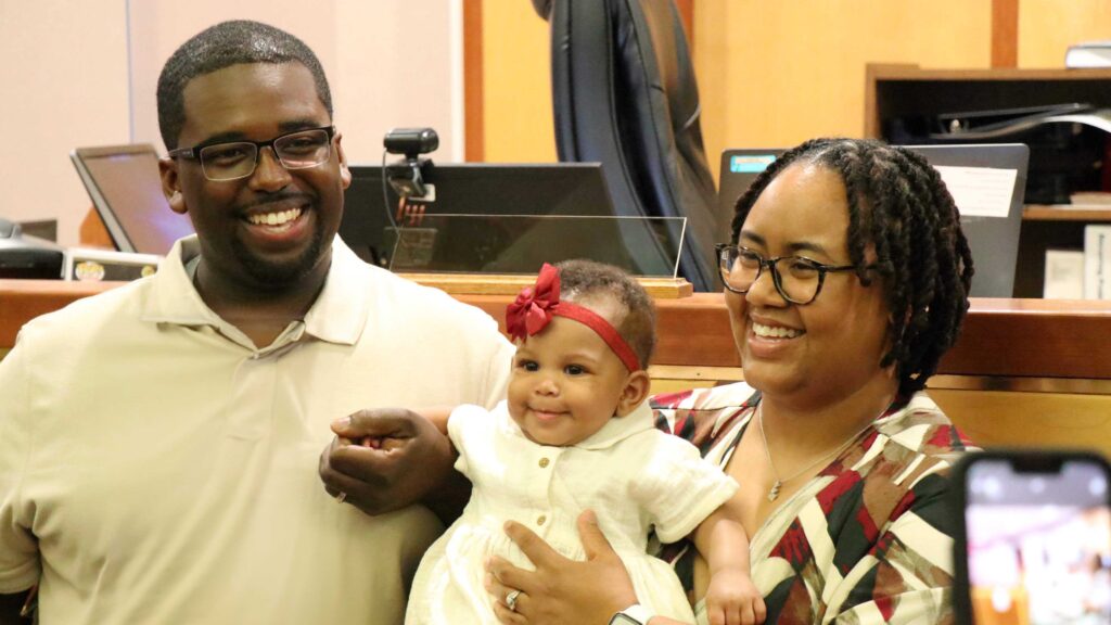 Adoptive parents Stephanie and Javon celebrate the adoption of their daughter, Heavenly Marie, in a Milwaulkee courtroom