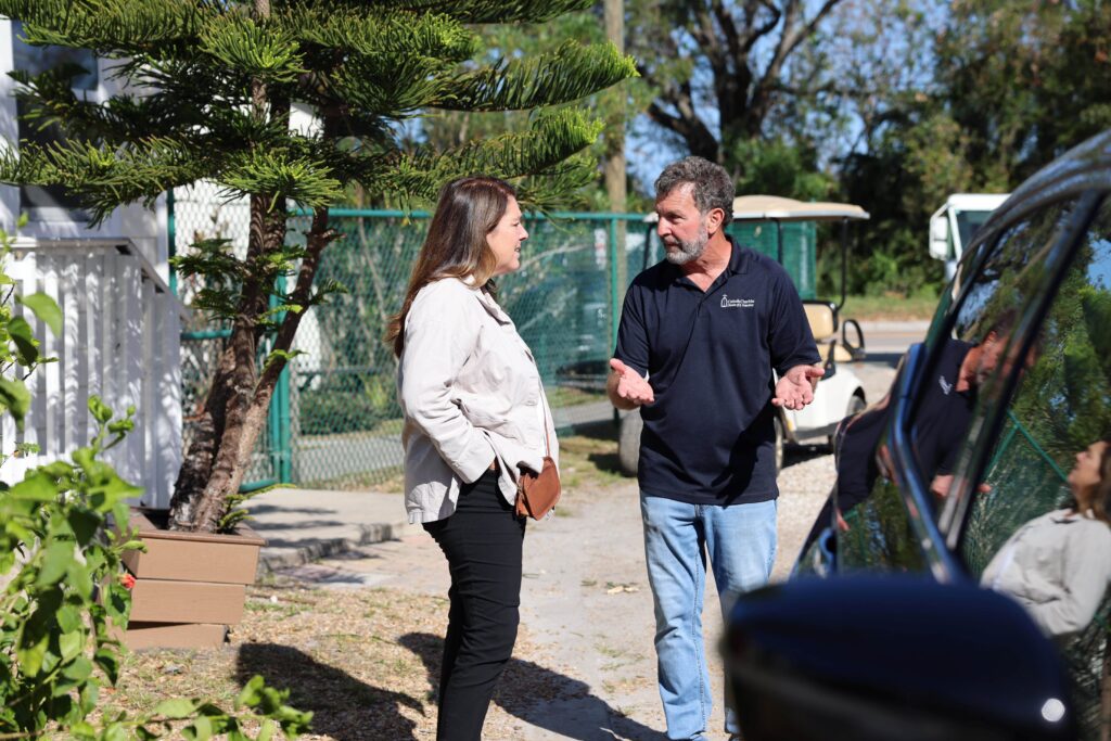 Kerry Alys Robinson (CCUSA president and CEO) receives a tour from Joseph Pondolfino, manager of Pinellas Hope, a program of Catholic Charities Diocese of St. Petersburg that provides services and shelter to individuals experiencing homelessness.